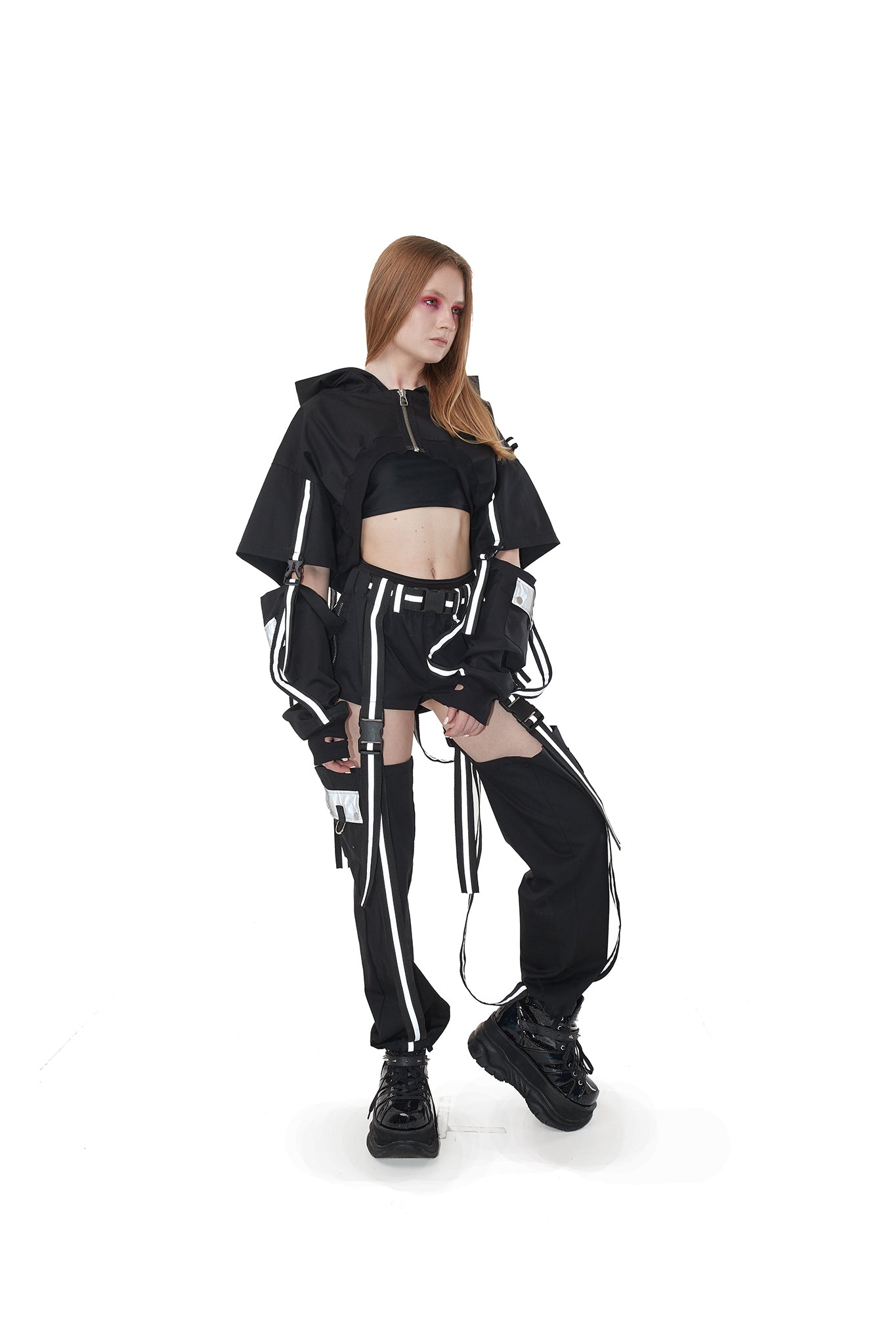 Hooded shrug in Black with reflective straps.